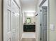 Bright hallway with a bathroom at the end at 5092 Sw 197Th Ter, Dunnellon, FL 34431