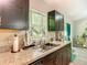 Well-lit kitchen featuring modern appliances and countertops with a large window at 5092 Sw 197Th Ter, Dunnellon, FL 34431