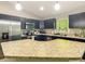Bright kitchen with stainless steel appliances and granite countertops at 5092 Sw 197Th Ter, Dunnellon, FL 34431