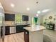 Open kitchen layout with modern appliances and view to the living area at 5092 Sw 197Th Ter, Dunnellon, FL 34431