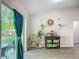 Cozy living room with sliding glass door, open floorplan, and views of backyard at 5092 Sw 197Th Ter, Dunnellon, FL 34431