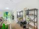 Bright living room with wood flooring, modern shelving, and a view to the outdoor patio at 5092 Sw 197Th Ter, Dunnellon, FL 34431