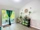Bright living area with stylish decor and access to the outdoors, creating a seamless indoor-outdoor living experience at 5092 Sw 197Th Ter, Dunnellon, FL 34431