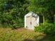 Outdoor storage shed surrounded by trees in backyard at 5092 Sw 197Th Ter, Dunnellon, FL 34431