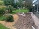 Landscaped backyard featuring a vintage bicycle, decorative rocks, and plenty of green space at 6512 Sw 60Th Ct, Ocala, FL 34474