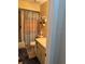Compact bathroom with a bathtub, tiled shower, toilet, and vanity with storage space at 6512 Sw 60Th Ct, Ocala, FL 34474