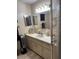 Functional bathroom with vanity, neutral color palette, large mirror, and ample lighting at 6512 Sw 60Th Ct, Ocala, FL 34474
