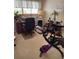 Bright room features a desk, exercise bike, and a large window with blinds at 6512 Sw 60Th Ct, Ocala, FL 34474