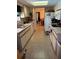 Bright kitchen features tiled floors, a skylight, and plenty of cabinet space at 6512 Sw 60Th Ct, Ocala, FL 34474