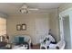 Cozy patio featuring wicker furniture, ceiling fan, and ample natural light, perfect for relaxing outdoors at 6512 Sw 60Th Ct, Ocala, FL 34474