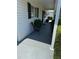 Comfortable front porch with seating area, offering a relaxed outdoor space with landscaping at 6512 Sw 60Th Ct, Ocala, FL 34474