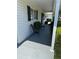 Charming front porch with seating, providing a welcoming entrance to the home at 6512 Sw 60Th Ct, Ocala, FL 34474