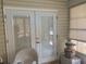 Bright sunroom with white trim and windows, creating a cozy space for relaxation and enjoyment of the outdoors at 6512 Sw 60Th Ct, Ocala, FL 34474