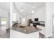 Kitchen boasts granite counters, stainless steel appliances, white cabinetry, and a breakfast bar at 6776 Sw 151St Loop, Ocala, FL 34473
