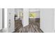 Inviting entryway flows into the living space, showcasing luxury vinyl flooring and views of the backyard at 6776 Sw 151St Loop, Ocala, FL 34473