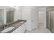 Spacious main bathroom featuring double vanity sinks, granite countertops, and glass enclosed shower at 6776 Sw 151St Loop, Ocala, FL 34473