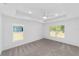 Carpeted main bedroom featuring recessed lighting and large windows for plenty of natural light at 6776 Sw 151St Loop, Ocala, FL 34473