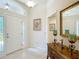 Bright entryway with white doors and tile flooring at 779 Oldsmar Ter, The Villages, FL 32163