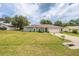 Charming home exterior with a well-manicured lawn, providing a welcoming curb appeal at 9 Fir Trail Pass, Ocala, FL 34472