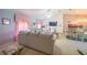 Bright living area featuring neutral paint, plush seating, modern TV, and recessed lighting at 9 Fir Trail Pass, Ocala, FL 34472