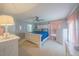 Spacious main bedroom with carpet, ceiling fan and stylish furniture at 9 Fir Trail Pass, Ocala, FL 34472