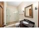 Clean bathroom features a glass shower, modern vanity, and a framed mirror at 950 Sw 43Rd Pl, Ocala, FL 34471