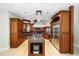 Spacious kitchen featuring custom cabinetry, stainless steel appliances, and a large center island at 950 Sw 43Rd Pl, Ocala, FL 34471