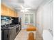Functional laundry room with modern washer and dryer, storage cabinets, and a folding area at 950 Sw 43Rd Pl, Ocala, FL 34471