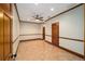 Living room with decorative trim, light-colored walls, and tan tile flooring at 950 Sw 43Rd Pl, Ocala, FL 34471