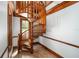 Unique, spiraling staircase constructed of wood with a nearby window at 950 Sw 43Rd Pl, Ocala, FL 34471
