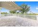 Enjoy the outdoors on this expansive paver patio, complete with a retractable awning and pristine landscaping at 9693 Sw 90Th St, Ocala, FL 34481
