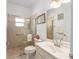 Bathroom with a tiled walk-in shower, marble countertop, and modern fixtures at 9693 Sw 90Th St, Ocala, FL 34481