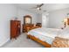Bedroom featuring a ceiling fan and access to hallway at 9693 Sw 90Th St, Ocala, FL 34481