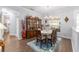 Elegant dining room with a glass table, wooden chairs, and a beautiful china cabinet at 9693 Sw 90Th St, Ocala, FL 34481