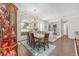 Charming dining room featuring a glass table, view to the foyer and an abundance of natural light at 9693 Sw 90Th St, Ocala, FL 34481