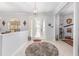 Open foyer with tile floors, decorative lighting, and elegant architectural details at 9693 Sw 90Th St, Ocala, FL 34481