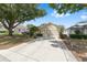 Charming single-story home with an extended concrete driveway to a two car garage at 9693 Sw 90Th St, Ocala, FL 34481