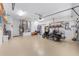 Spacious and organized garage with epoxy flooring and a golf cart at 9693 Sw 90Th St, Ocala, FL 34481