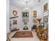 Cozy hallway adorned with unique art and decor, showcasing the home's character at 9693 Sw 90Th St, Ocala, FL 34481