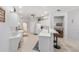 Spacious kitchen featuring white cabinetry and a bar with seating at 9693 Sw 90Th St, Ocala, FL 34481