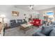 Cozy living room with modern furniture, decorative accents, and seamless flow to dining area at 9693 Sw 90Th St, Ocala, FL 34481