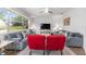 Well-lit living room with plush seating, area rug, and an entertainment center at 9693 Sw 90Th St, Ocala, FL 34481