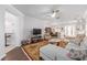 Spacious living room featuring a ceiling fan and view into the dining room at 9693 Sw 90Th St, Ocala, FL 34481