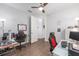 An office setup with wood floors, dual monitors, and comfortable gaming chairs at 9693 Sw 90Th St, Ocala, FL 34481