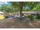 Serene backyard view with mature trees and patio at 9726 Sw 94Th Ter # C, Ocala, FL 34481
