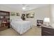 Bright bedroom with bookshelves, large windows, and a ceiling fan at 9726 Sw 94Th Ter # C, Ocala, FL 34481