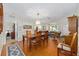Spacious dining area with hardwood floors, connecting to the living room for easy entertaining at 9726 Sw 94Th Ter # C, Ocala, FL 34481