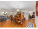 Spacious dining area with hardwood floors connecting to the living room for easy entertaining at 9726 Sw 94Th Ter # C, Ocala, FL 34481