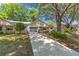 Well-maintained single-story home with mature trees, a long driveway, and a cozy front porch at 9726 Sw 94Th Ter # C, Ocala, FL 34481