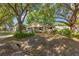 Charming home nestled among mature trees, featuring a cozy front porch and well-maintained landscaping at 9726 Sw 94Th Ter # C, Ocala, FL 34481